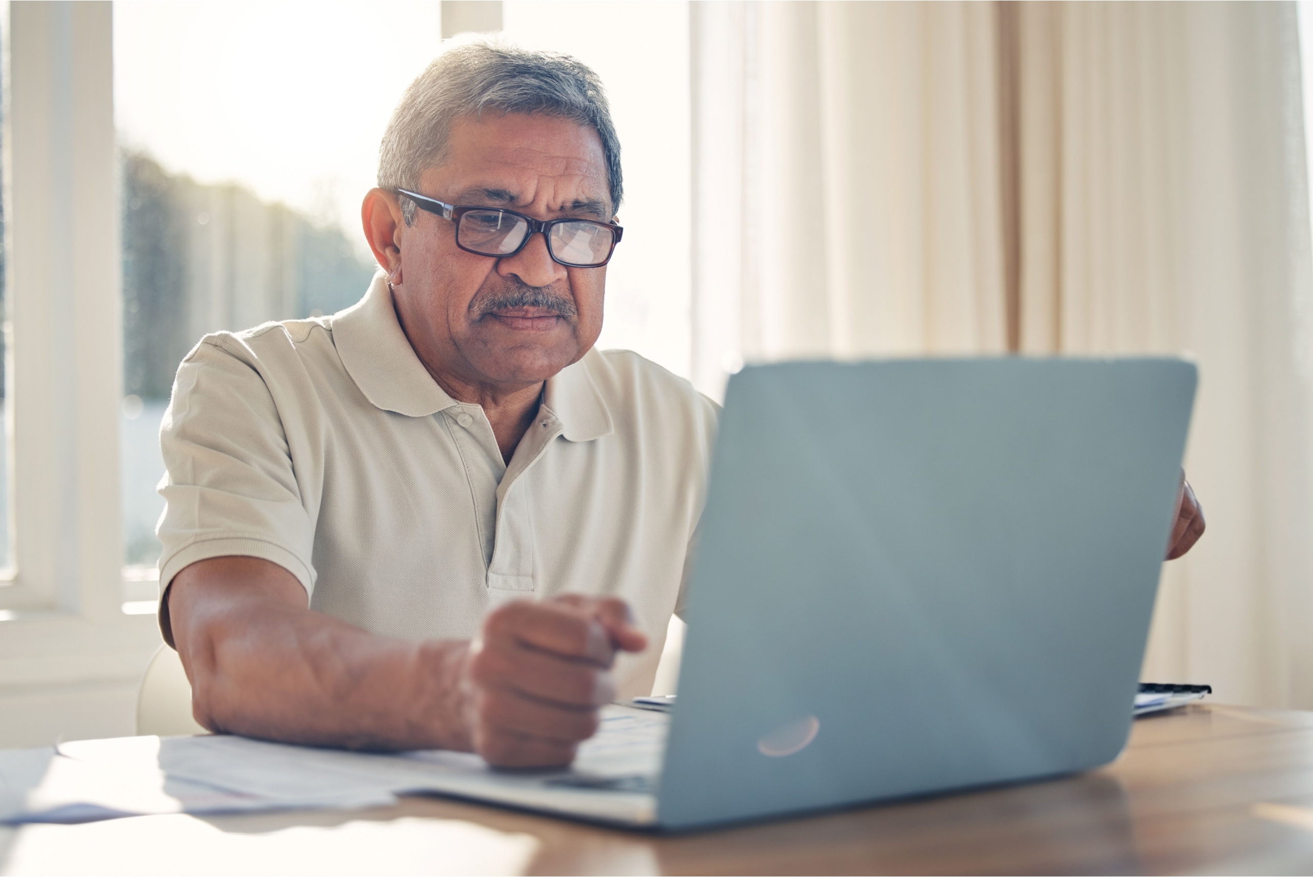 A man using a laptop.