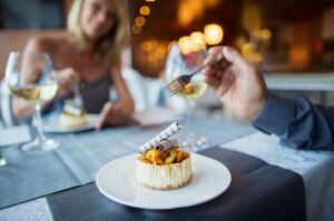 A couple enjoying a meal in a restaurant.